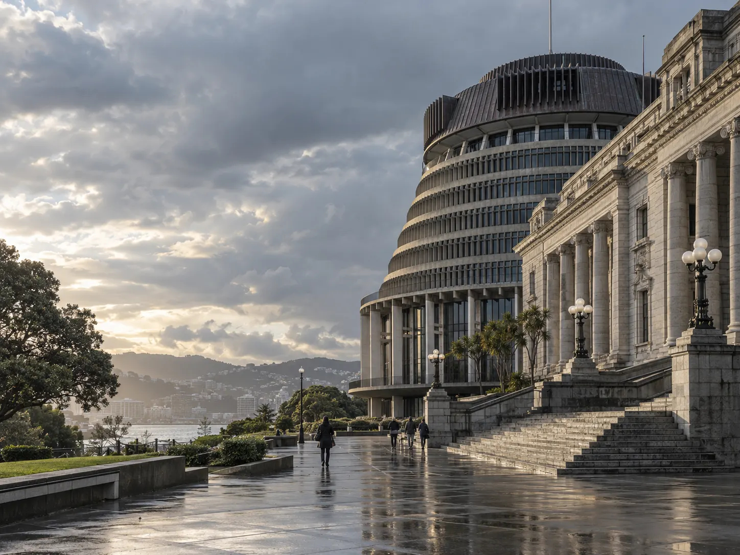Parliament Buildings and the Beehive in Wellington under evening cloud, wet forecourt in the foreground